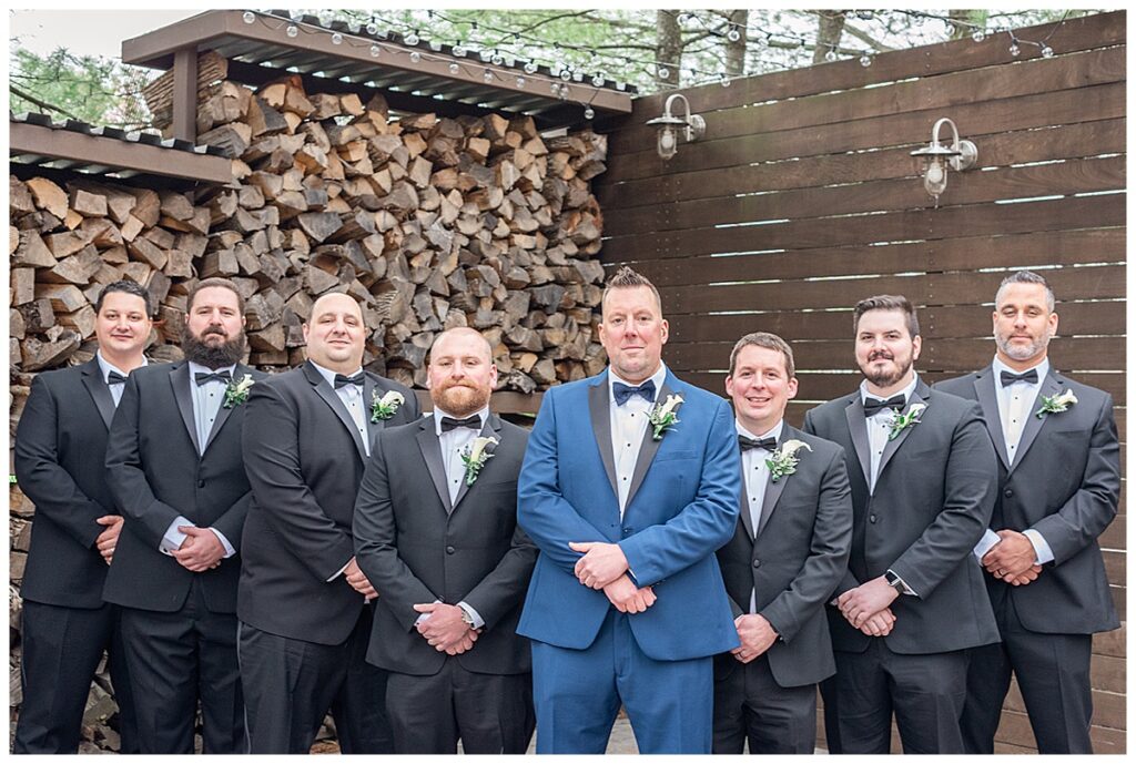 groomsmen stone house log wall