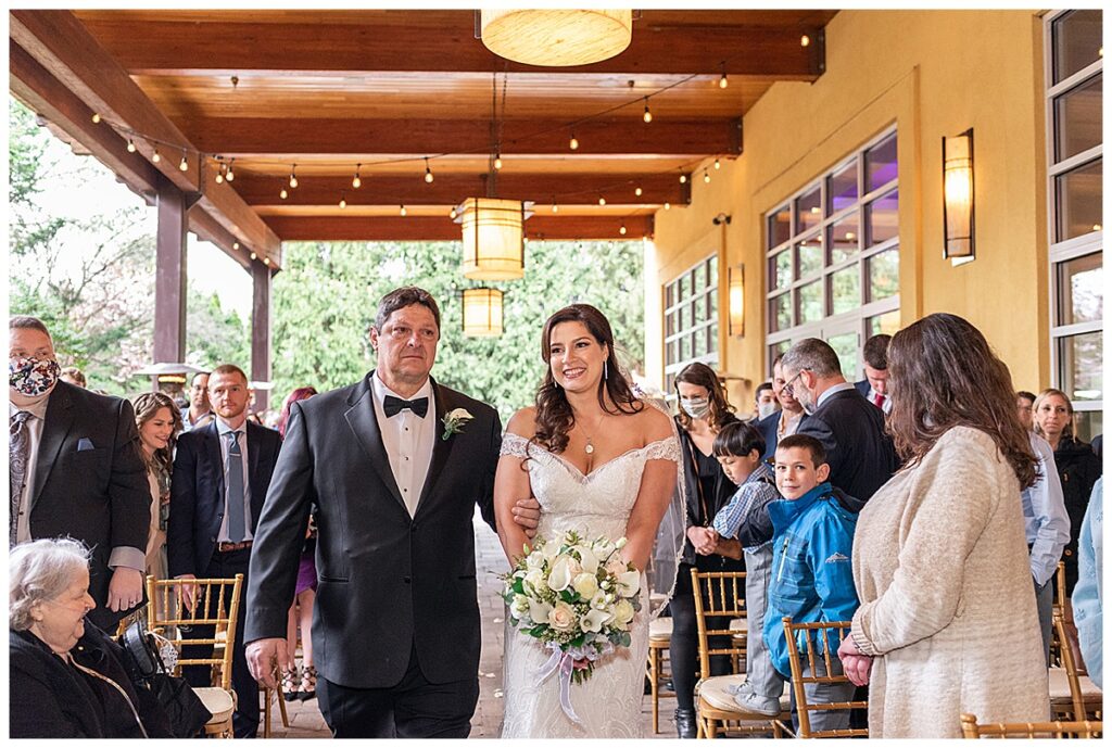 father walks bride down the aisle