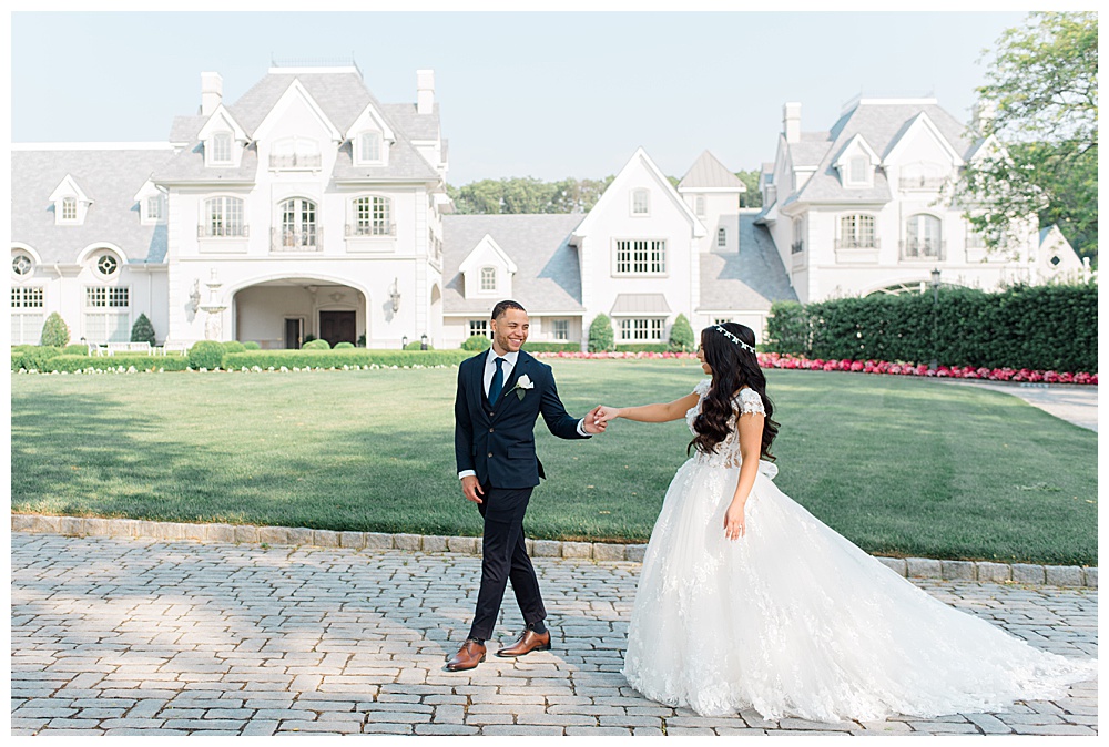 bride and groom in front of park chateau