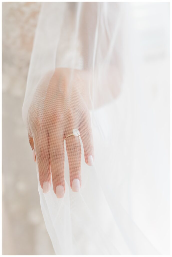 gold engagement ring and veil