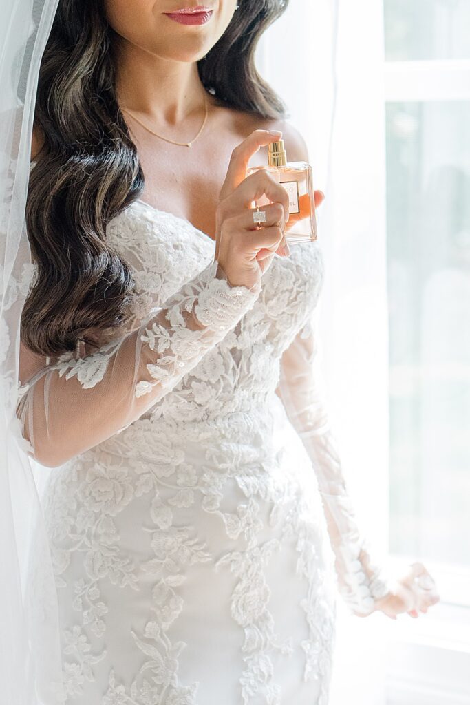 bride putting on perfume