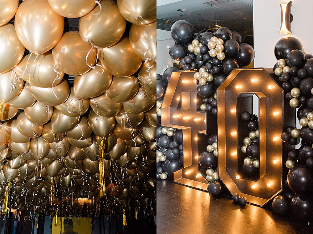 black and gold balloons and 40 light up marquee sign