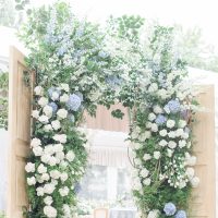blue and white floral wedding arch